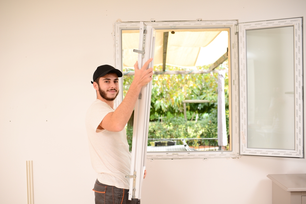 Handsome,Young,Professional,Man,Installing,And,Replacing,A,New,Home