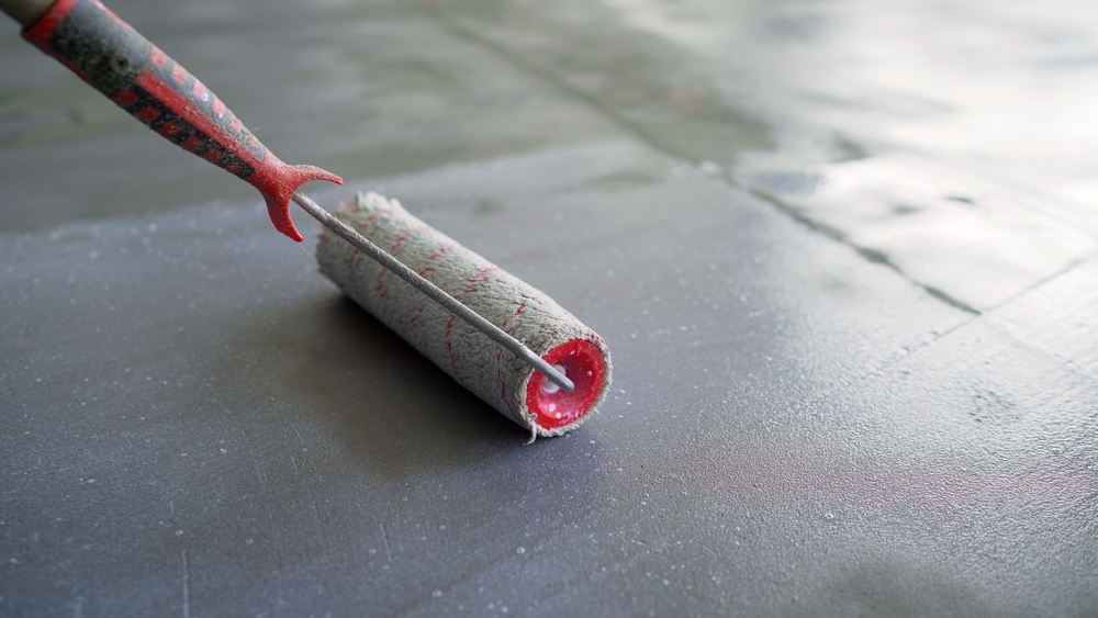 Concrete,Floor,Primer.,The,Process,Of,Applying,A,Primer,With